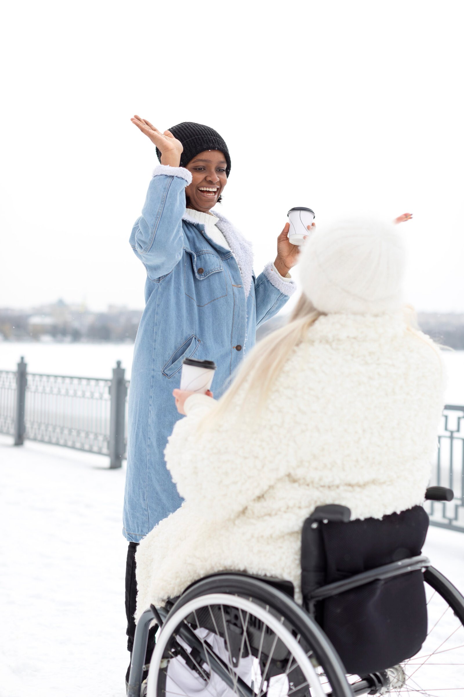 full shot women holding coffee cups