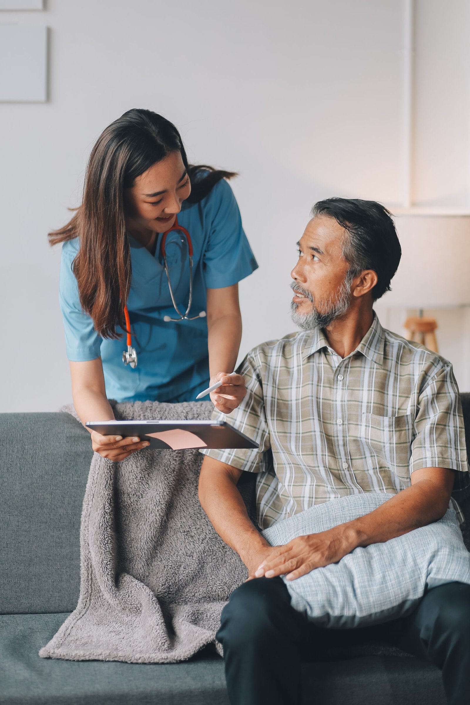 caregiver doctor or nurse training stretching leg and knee with