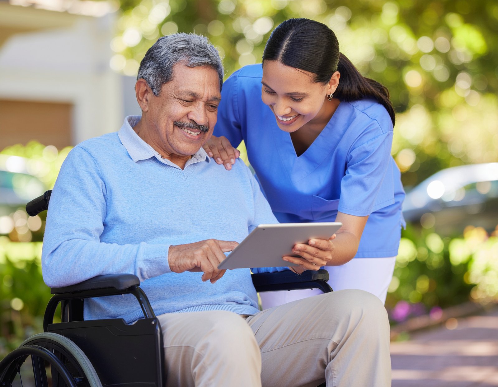 vecteezy smiling caregiver helps older adult explore a tablet 71070503